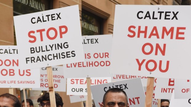 Protest: Franchisee Sanjeev Sharma takes to the streets of Sydney.