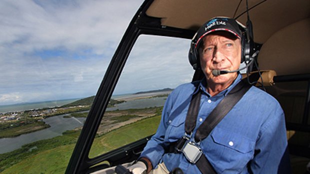 Sir Graham McCamley, photographed at the controls of his helicopter over central Queensland last year.