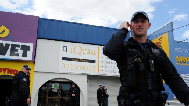 Police raid a Logan Islamic centre in September.