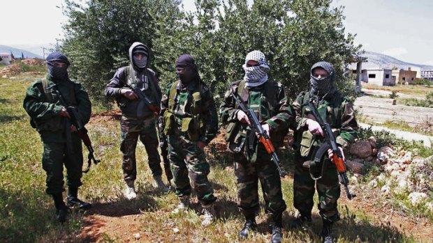 Members of a Hezbollah-backed militia at the Lebanon-Syria border, near the town of al-Qasr.