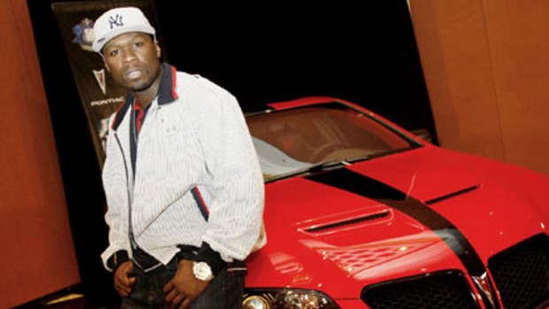 Rapper 50 Cent and a Pontiac G8.