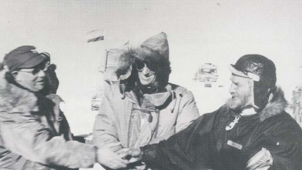 Rivals...Edmund Hillary, centre, and Vivian Fuchs, right, with their fellow explorer George Dufek.