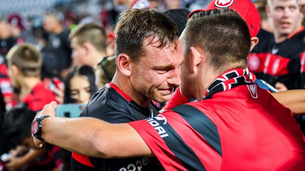 Tough loss: Wanderers striker Brendon Santalab in tears after their 5-0 derby defeat to Sydney FC.