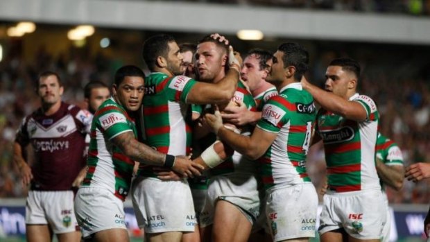 Happy Bunnies: Souths celebrate Sam Burgess' first-half try.