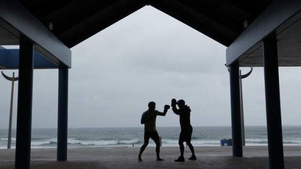 Keeping his killer instincts: David Warner and trainer Wayne Geber at Maroubra.