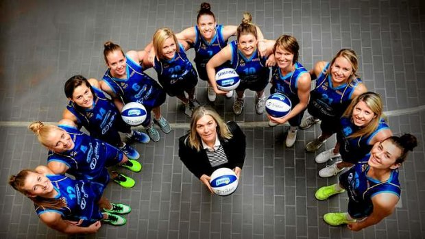 Canberra Capitals coach Carrie Graf with her team (from  left) Carly Mijovic, Abby Bishop, Isabelle Strunc, Alice Coddington, Tara Hey, Nat Hurst, Nicole Hunt, Jess Bibby, Sarah McAppion, Carly Wilson and Alex Bunton.