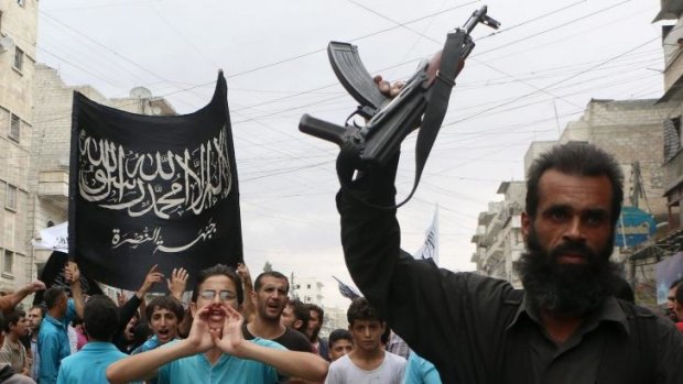 Street march: Supporters of the Al Nusra Front protest against Syrian President Bashar al-Assad and the international coalition in Aleppo.