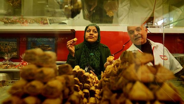 Dangerous diet &#8230; Hana Hajeh, a diabetic, shops for sugar-free sweets in preparation for Ramadan. She is served by Allen Sayed from Abu Adam Sweets in Lakemba.