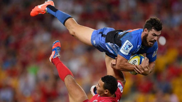 Jayden Hayward of the Force collides midair with Jonah Placid of the Reds at Suncorp Stadium.