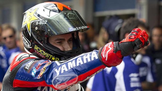Jorge Lorenzo pumps his fist in elation after taking pole position for the Spanish MotoGP.