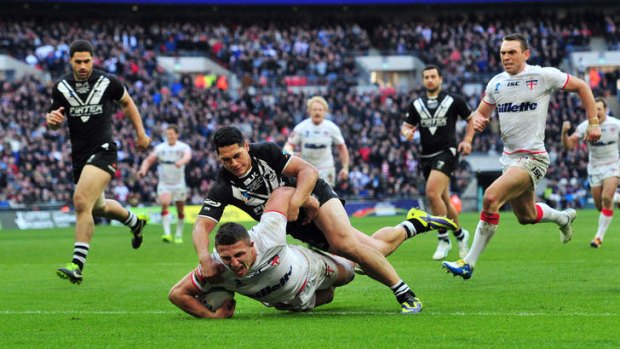 Sam Burgess scores a try against New Zealand in the World Cup semi-final.