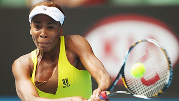 Venus Williams fires a backhand during today's quarter-final against China's Na Li.