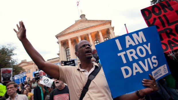 Protesters for Troy Davis gather on the steps of the Georgia Capitol building.