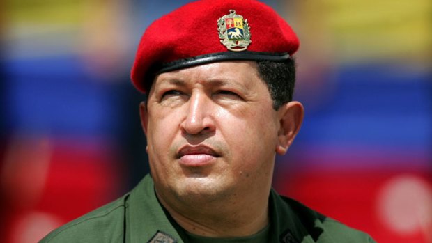 Venezuela's President Hugo Chavez wears an army uniform and the red beret of his parachute regiment while attending a military parade in Caracas in this April 13, 2005.