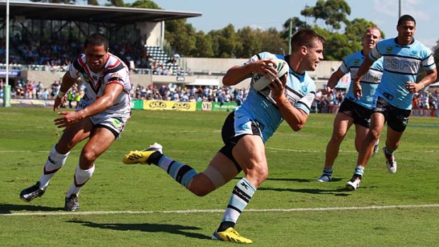 Prepared: Beau Ryan scores a try for the Sharks on Sunday following the return of  coach Shane Flanagan.