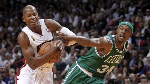 Miami recruit Ray Allen gets in a tangle with former Boston Celtics teammate Paul Pierce on opening night of the NBA season.