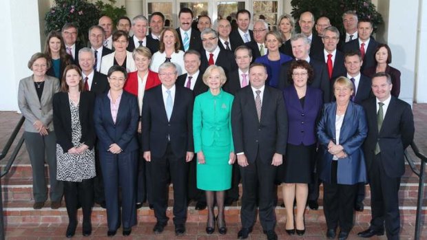 Prime Minister Kevin Rudd and Governor General Quentin Bryce with new members of the Rudd ministry after the swearing-in ceremony at Government House in Canberra on Monday July 1, 2013.