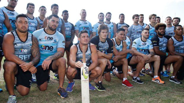 Tribute: Sharks players honour the memory of Phillip Hughes on Saturday.