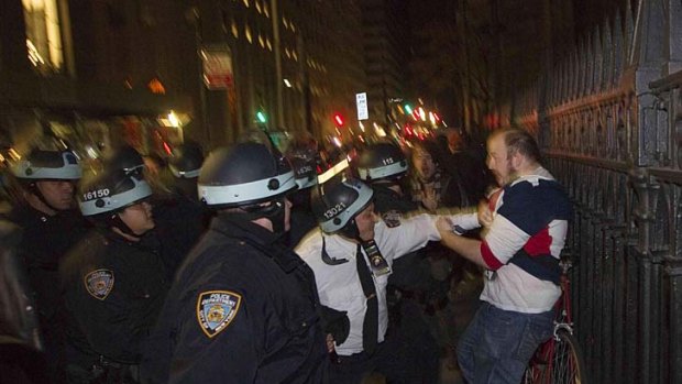 Tempers flare .. a police officer gets to grips with a protester.