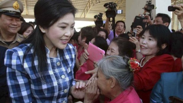 Government stronghold: Supporters greet Thailand's Prime Minister Yingluck Shinawatra (front L) in the northern town of Chiang Mai.
