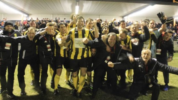 Glory days: South Springvale players, fans and officials celebrate as the team marches on in the FFA Cup.