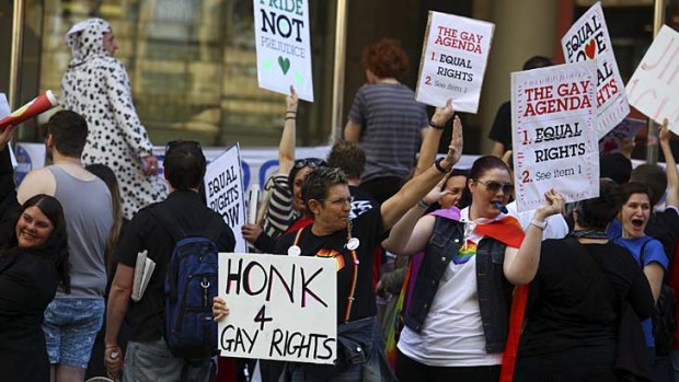 Members of the gay, lesbian, bisexual, transgender and intergendered community protest outside the LNP state conference.