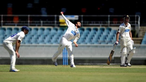 NSW bowler Nathan Lyon in action on Wednesay at Manuka Oval.