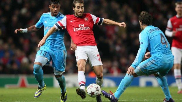 Mathieu Flamini closes in on the ball.