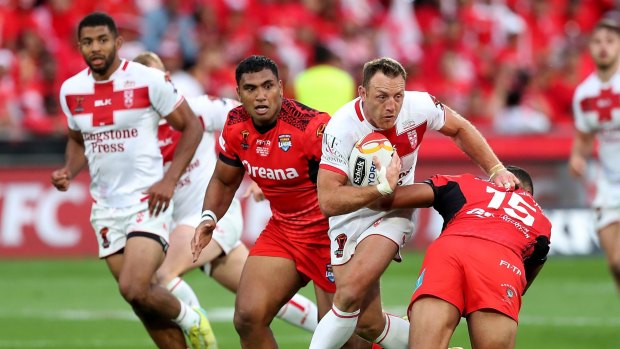 Worthy opponent: James Roby steps the Tongan defence during England's semi-final scare.