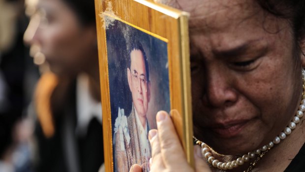 Tears for a king. A Thai holds a photo of the country's late King, who died last week after a lengthy illness