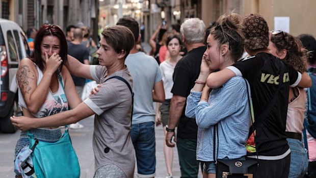 Pedestrians in shock moments after the van drove through crowds on Las Ramblas in Barcelona.