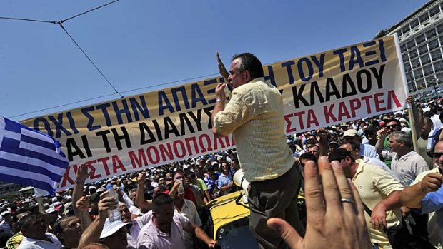 Taxi drivers protest on July 19, 2011 in front of the Greek Parliament on the second day of their 48-hours strike.