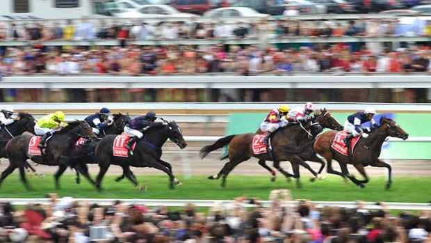 Low flying: Green Moon surges to the line in the Melbourne Cup.