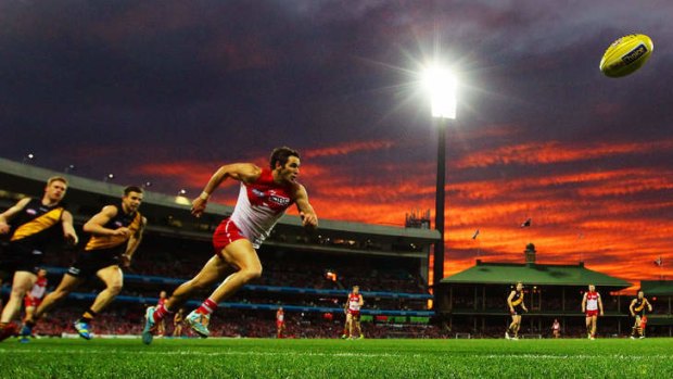 Shining brightly: Sydney's Josh Kennedy leads a pack of Tigers at the SCG on Sunday.