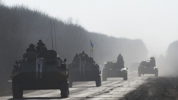 Ukrainian troops ride on armoured vehicles near Artemivsk. 