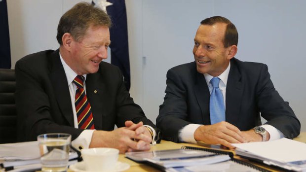 Pay rise: Secretary of the Department of the Prime Minister and Cabinet Ian Watt talks to Prime Minister Tony Abbott.