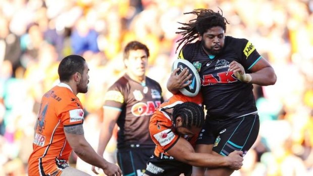 Battle of the big cats: Jamal Idris stands tall in the Panthers' win over the Tigers.