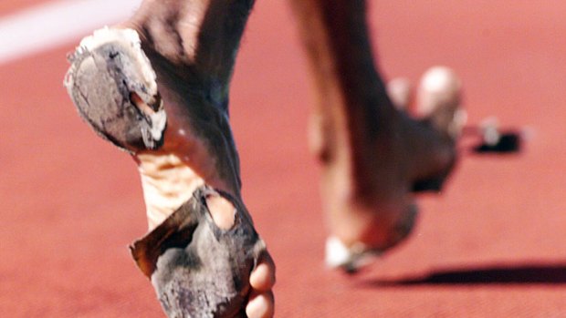 Stressfull ... An athlete competes barefoot at the Australian Track and Field Championships.