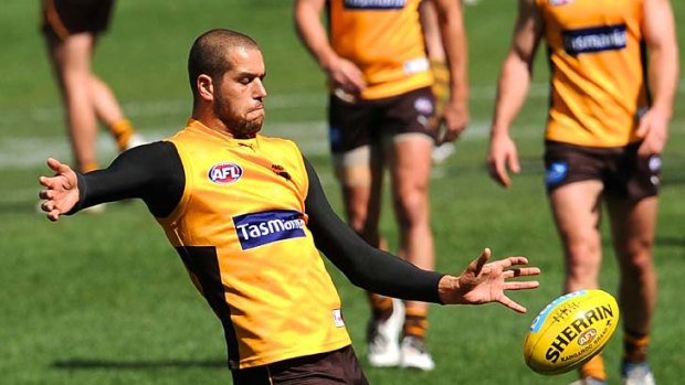 Lance Franklin trains away from his teammates yesterday.