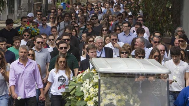 Farewell &#8230; the funeral procession for Roberto Laudisio Curti arrives at the Sao Paulo cemetery. The Brazilian student died in Sydney last month during a run-in with police.