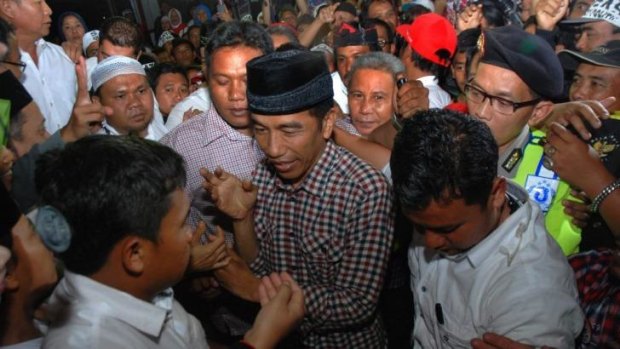 Presidential candidate Joko Widodo with supporters as he campaigns in West Java. 