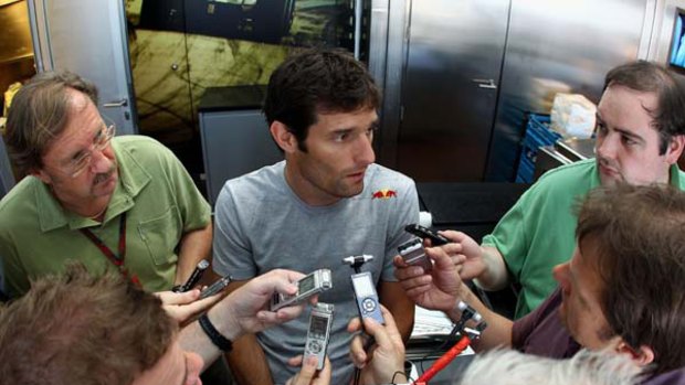 Close shave ... Mark Webber of Australia and Red Bull Racing is interviewed by the media following his dramatic accident.