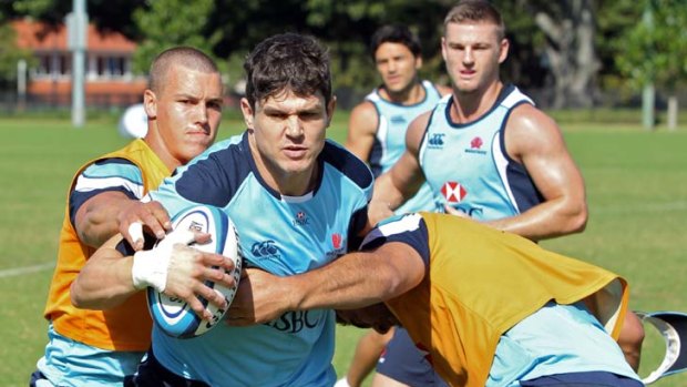 Statistical errors &#8230; Tom Carter hits the ball up at Waratahs training yesterday and will again pair with Rob Horne, who has chalked up the most missed tackles in the competition.