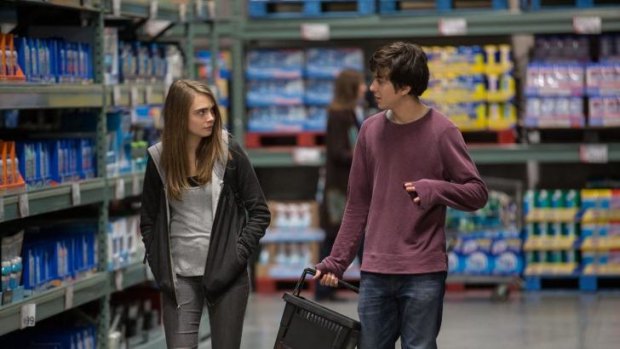 Cara Delevingne as Margo Roth Spiegelman and Nat Wolff as Quentin Jacobsen in the film <i>Paper Towns</i>.