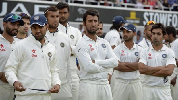 India's players look on during the presentations after losing.