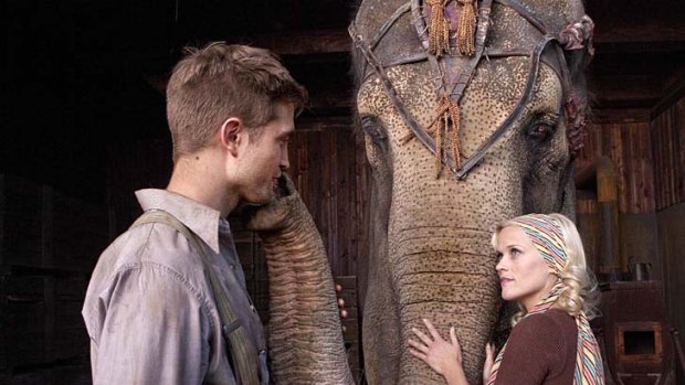 Robert Pattinson and Reese Witherspoon with Tai in a scene from Water for Elephants.