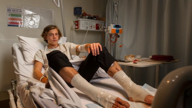 Sam Kanizay rests in hospital after being bitten while soaking his legs after a footy match.