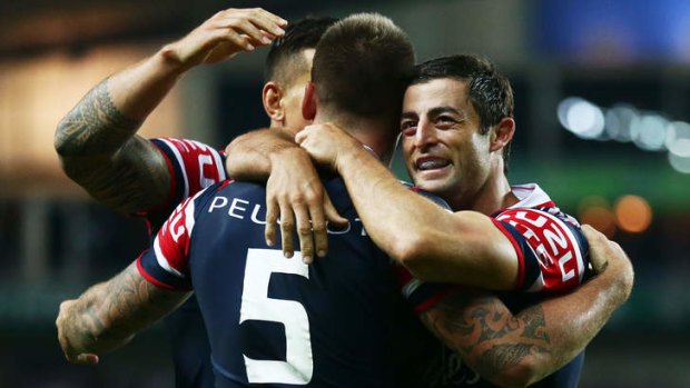 Anthony Minichiello of the Roosters celebrates a try against Wigan.