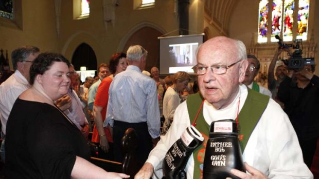 Father Bob Maguire bids his final farewell to a capacity congregation at Saints Peter and Paul Church in South Melbourne yesterday.