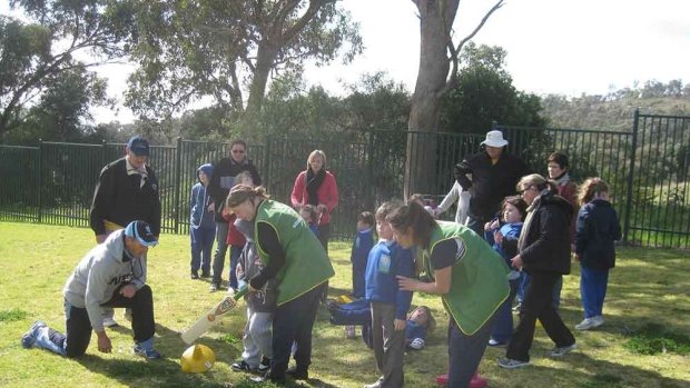 Children are supported by volunteers when they take part in the DreamCricket clinics.